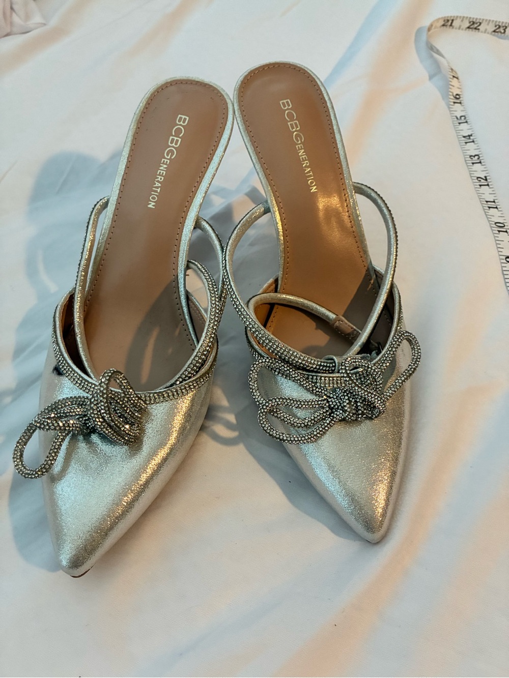 BCBGeneration Metallic Silver Pointed Slingback Mules with Crystal Bow
